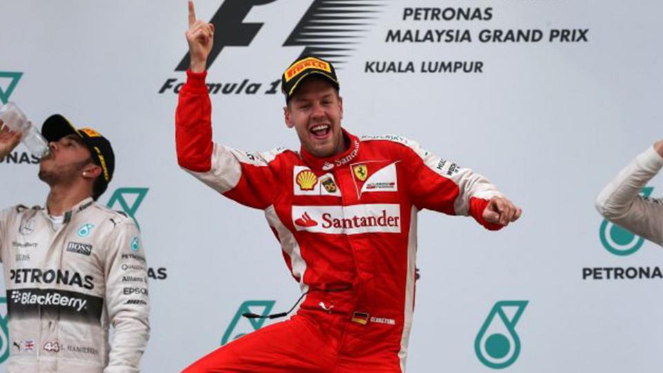 Sebastian Vettel saat melakukan selebrasi. - INDOSPORT